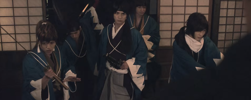 The actors wearing period gear in the intro.